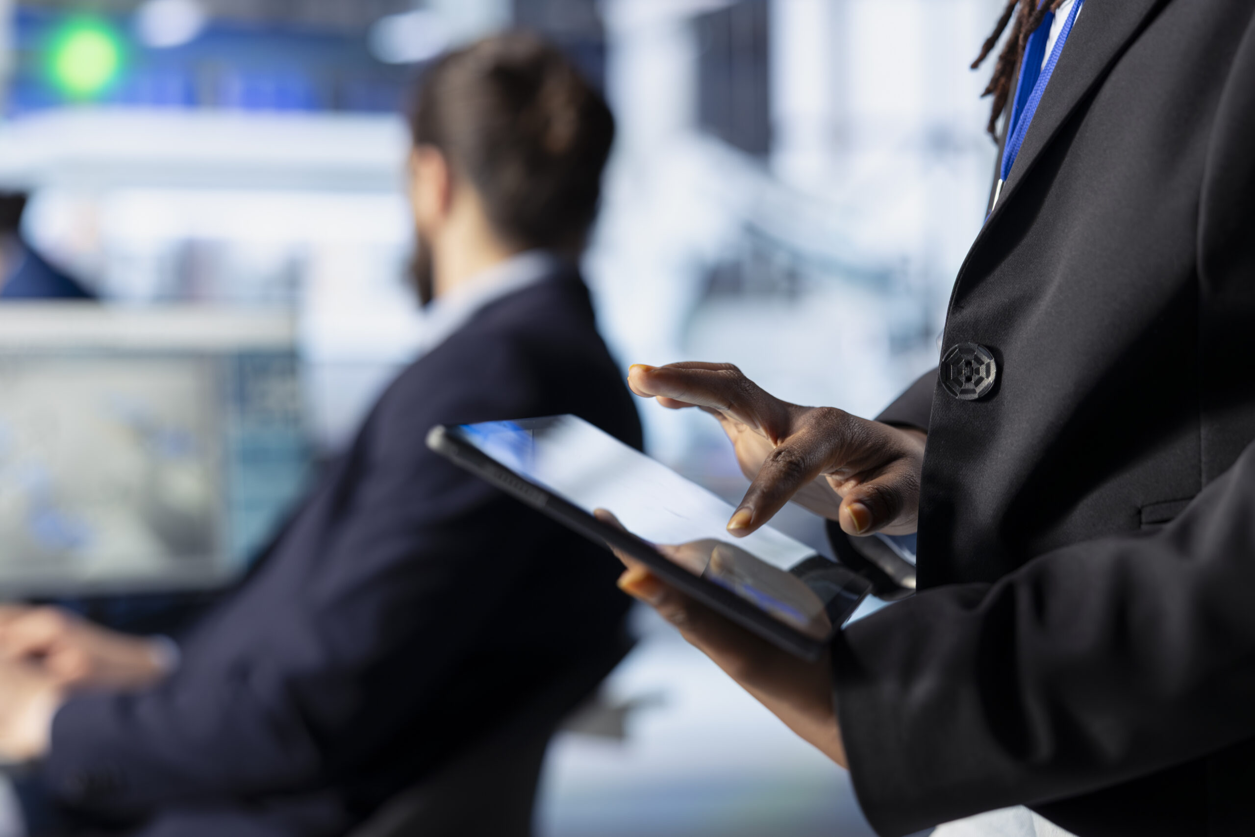 close up of employee walking with tablet in photovoltaics factory